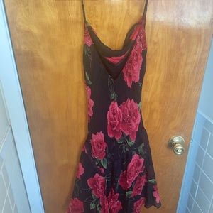 Waist fitting, flowly high low beaded details.